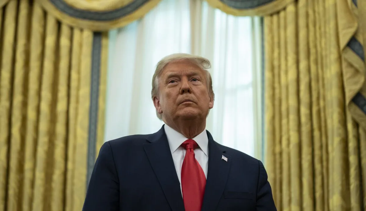 President Donald Trump listens during a ceremony in the Oval Office of the White House in Washington on Dec. 3, 2020. (Evan Vucci/AP Photo)