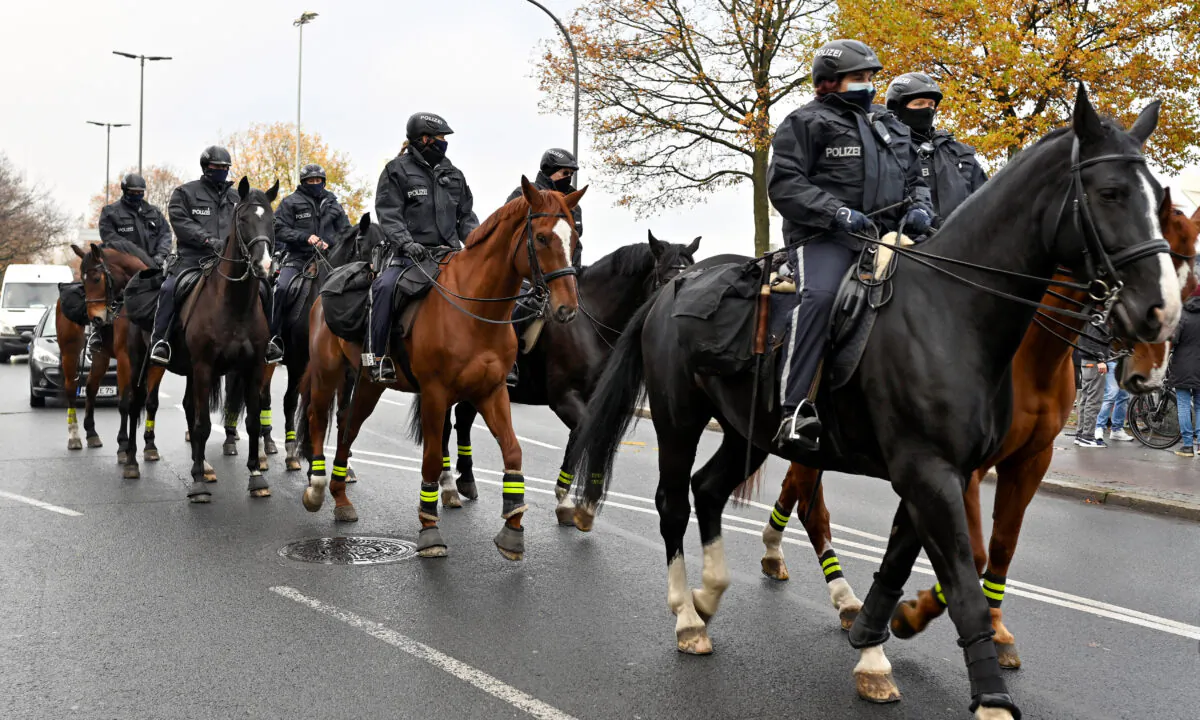 Mounted police patrol the site where a protest against government restrictions is supposed to take place in Bremen, Germany, on Dec. 5, 2020. (Fabian Bimmer/Reuters)
