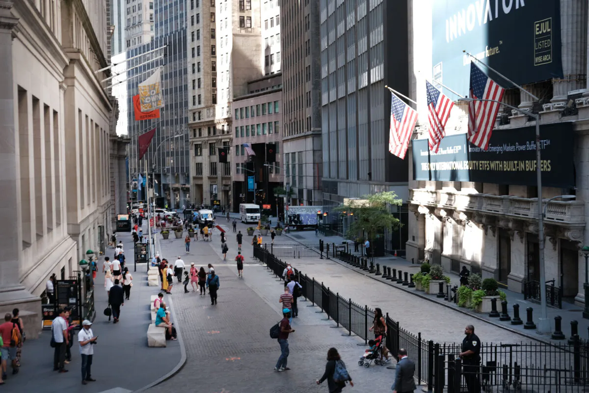 People walk by the New York Stock Exchange (NYSE) on July 02, 2019 in New York City. (Spencer Platt/Getty Images)