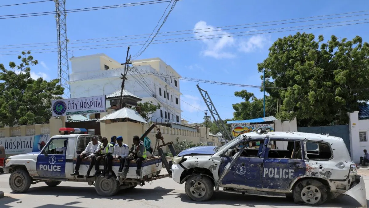 Somali police officers tow their car from the scene of a roadside explosion in Hodan district of Mogadishu, Somalia, on July 8, 2020. (Feisal Omar/File Photo, Reuters)