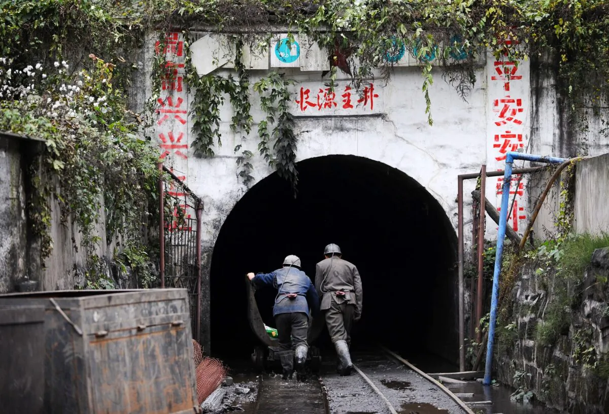 Chinese coal miners prepare to close the Changyuan mine, in southwest China's Sichuan province, on Dec. 10, 2009. (AFP/AFP via Getty Images)