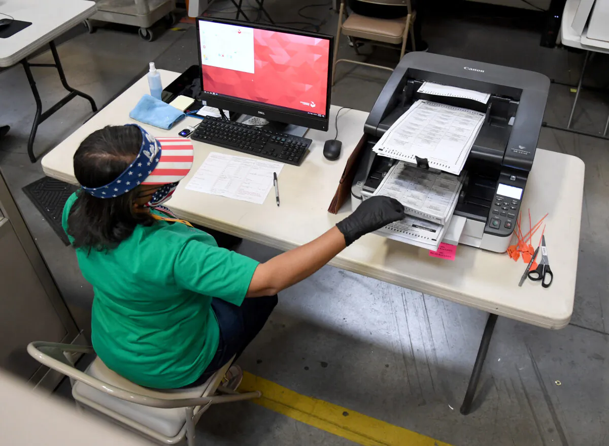 A Clark County election worker scans mail-in ballots at the Clark County Election Department on November 7, 2020, in North Las Vegas, Nevada. (Ethan Miller/Getty Images)