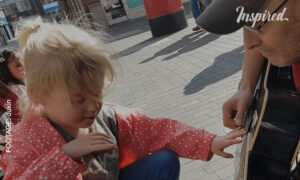 Seven-Year-Old Blind Girl Plays the Guitar With Busker