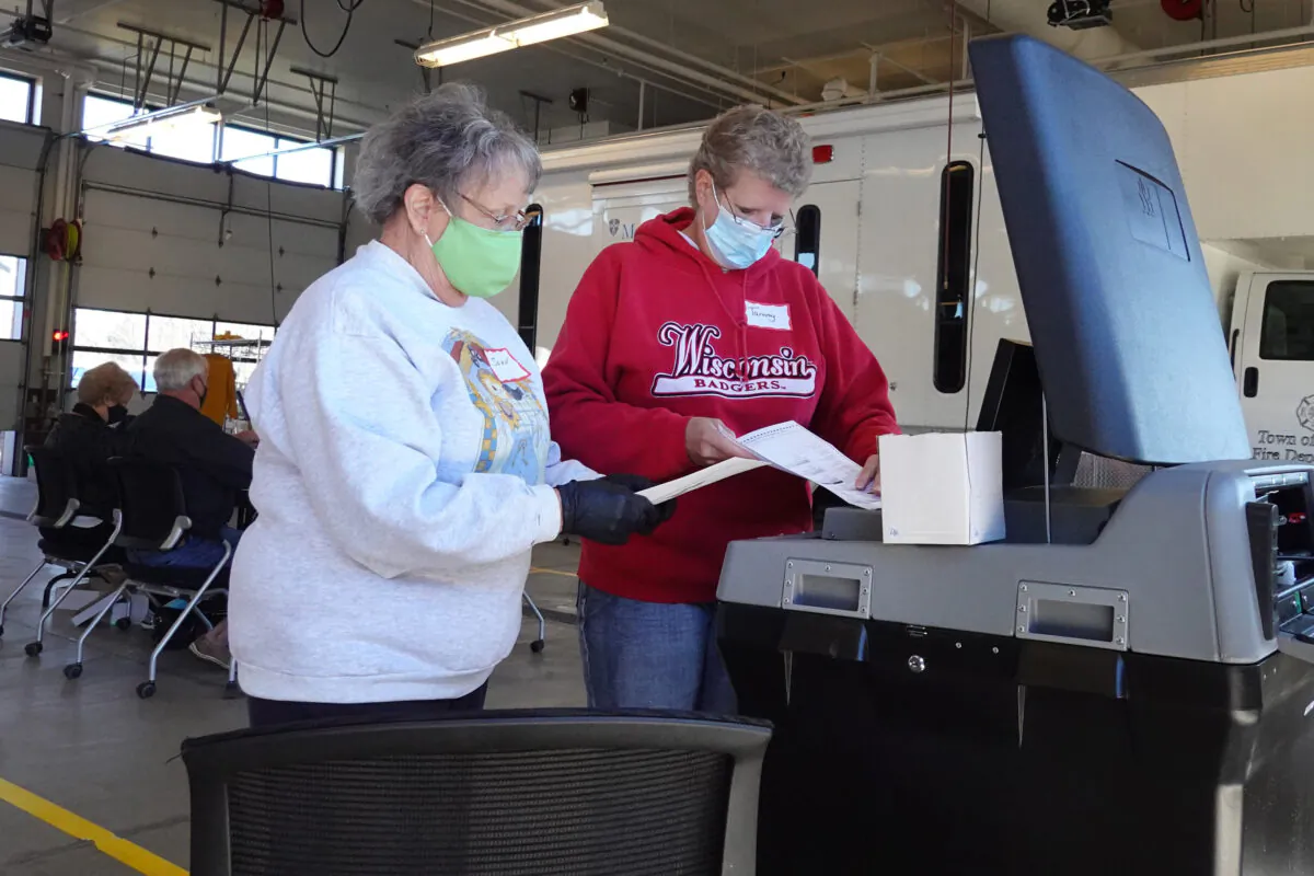 Election officials count absentee ballots at a polling place in the Town of Beloit fire station near Beloit, Wis., on Nov. 3, 2020. (Scott Olson/Getty Images)
