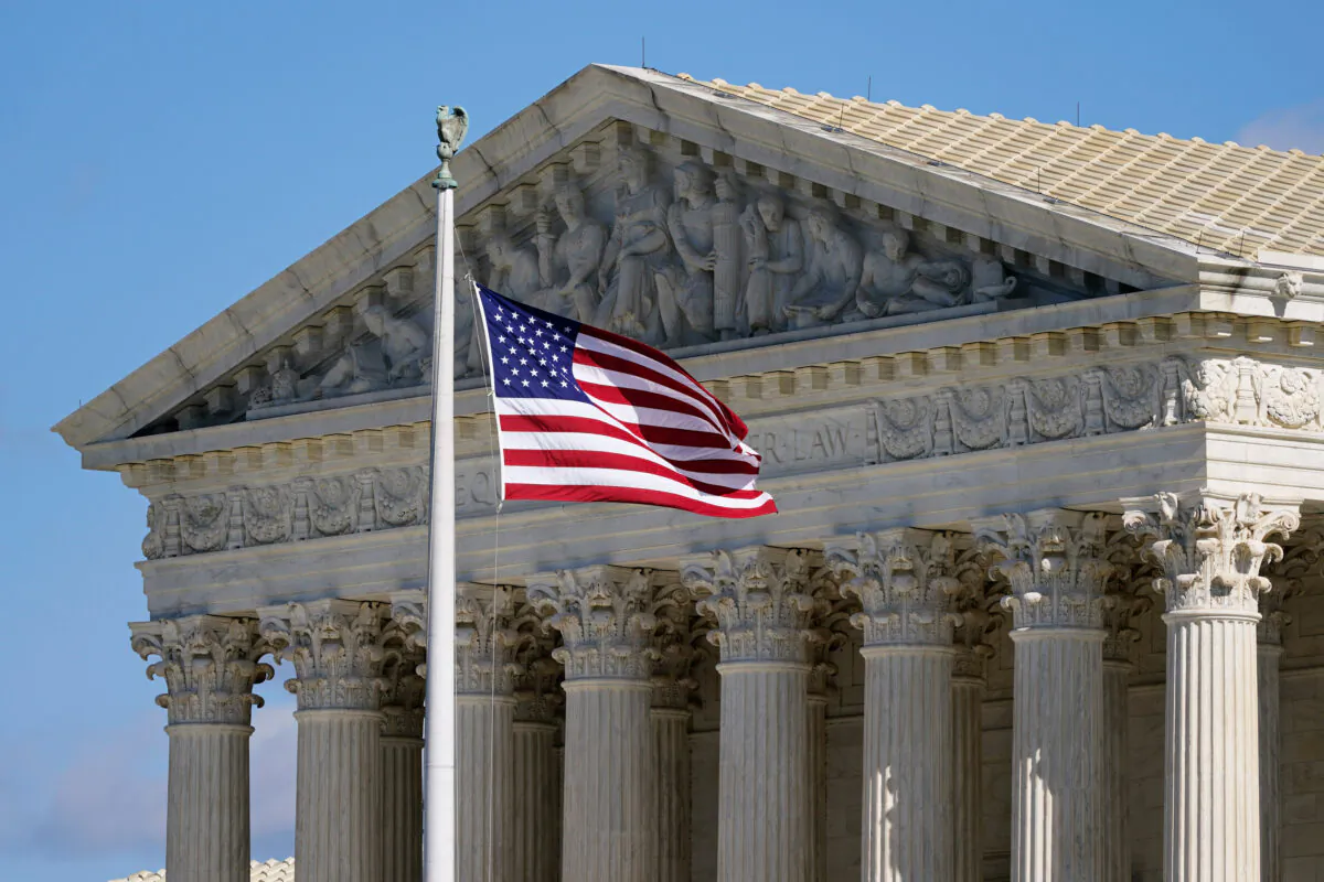 An American flag waves in front of the Supreme Court building on Capitol Hill in Washington, on Nov. 2, 2020. (Patrick Semansky/AP Photo)
