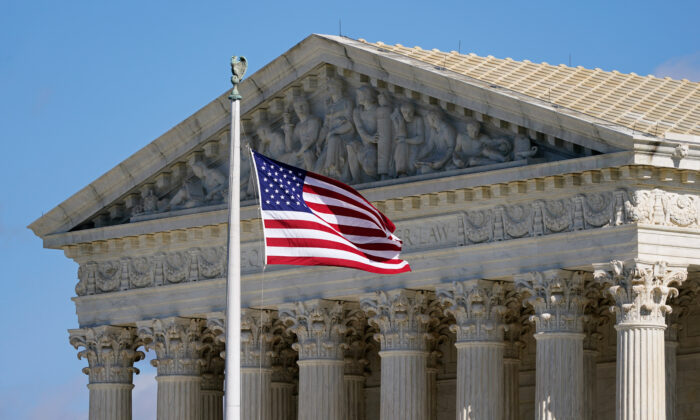 An American flag waves in front of the Supreme Court building on Capitol Hill in Washington, on Nov. 2, 2020. (Patrick Semansky/AP Photo)