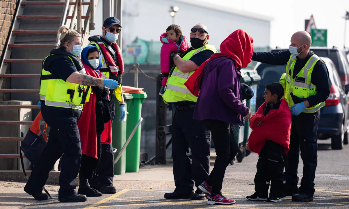 A migrant family is taken into port after being intercepted by Border Force officials in the English Channel, in Dover, England, on Sept. 22, 2020. (Luke Dray/Getty Images)