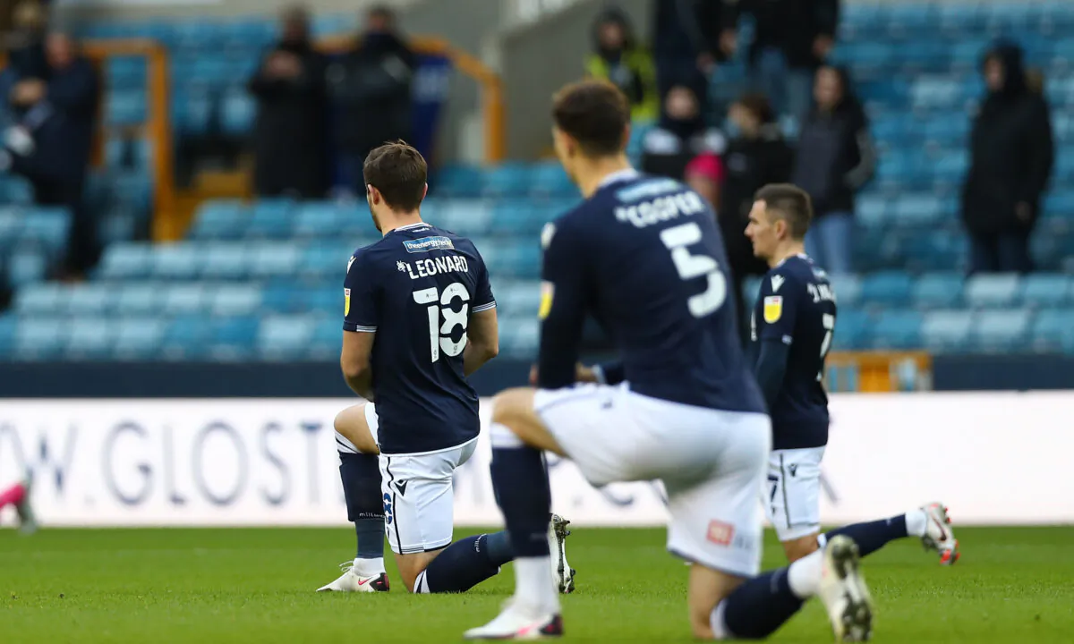 Ryan Leonard of Millwall kneeling for Black Lives Matter during the Sky Bet Championship match between Millwall and Derby County at The Den in London, on Dec. 05, 2020. (Jacques Feeney/Getty Images)