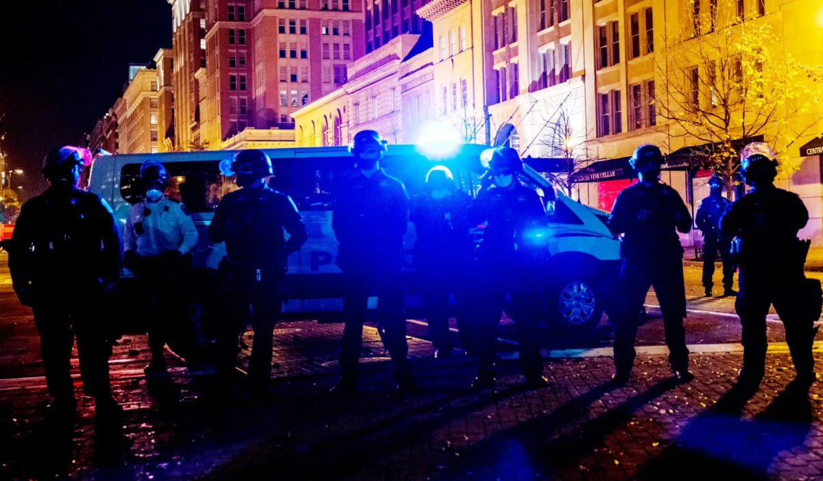 Police block off a street from an Antifa group prior to clashes in this file photo taken in Washington on Nov. 14, 2020. (Samuel Corum/Getty Images)