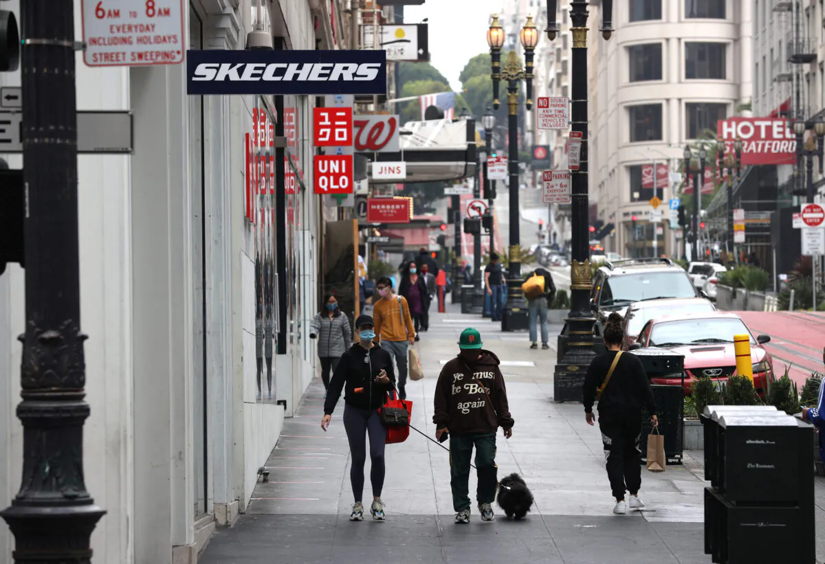 Fewer than normal shoppers walk through San Francisco's Union Square shopping district in San Francisco on Sept. 3, 2020. (Justin Sullivan/Getty Images)