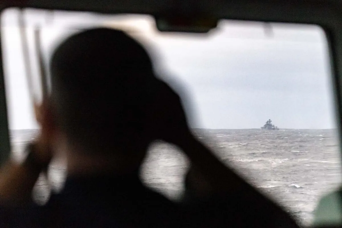 An undated photo showing a sailor aboard the British naval vessel HMS Northumberland monitoring the movement of Vice-Admiral Kulakov, an Udaloy-class destroyer, in waters off the coast of Scotland. (UK Royal Navy)