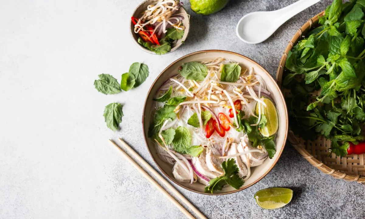 An assortment of fresh herbs, among other crunchy, raw veggie fixings, is essential to the pho experience. (Sentelia/Shutterstock)