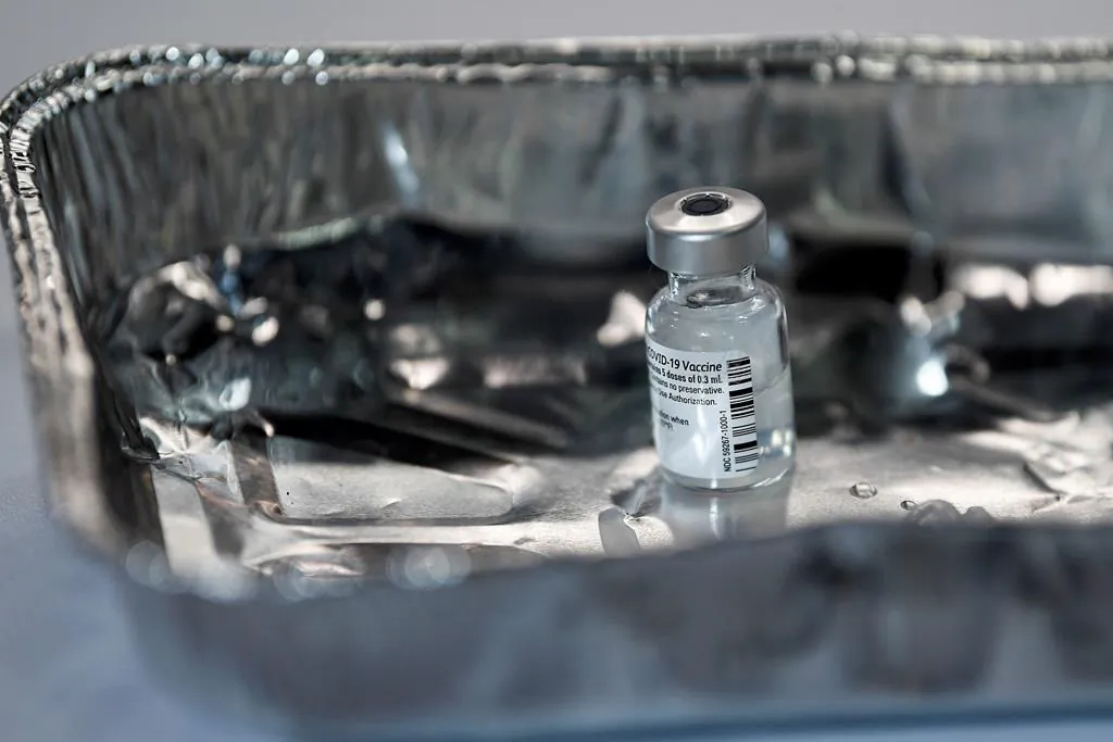 A vial of the Pfizer-BioNTech COVID-19 vaccine at the NHS Louisa Jordan Hospital in Glasgow, Scotland, Dec. 8, 2020.  (Jeff J Mitchell/Pool via AP)