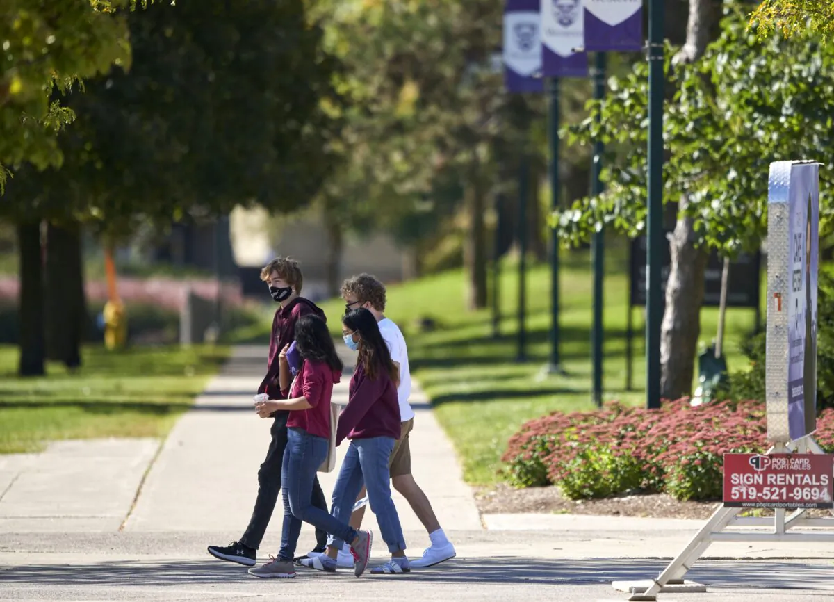 Students walk across campus at Western University in London, Ont., on Sept. 19, 2020. (The Canadian Press/Geoff Robins)