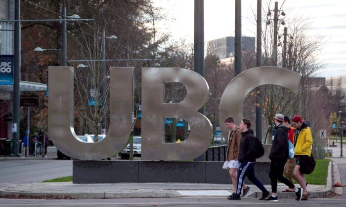 Students walk past the UBC sign at the University of British Columbia in Vancouver in a file photo. (Darryl Dyck/The Canadian Press)