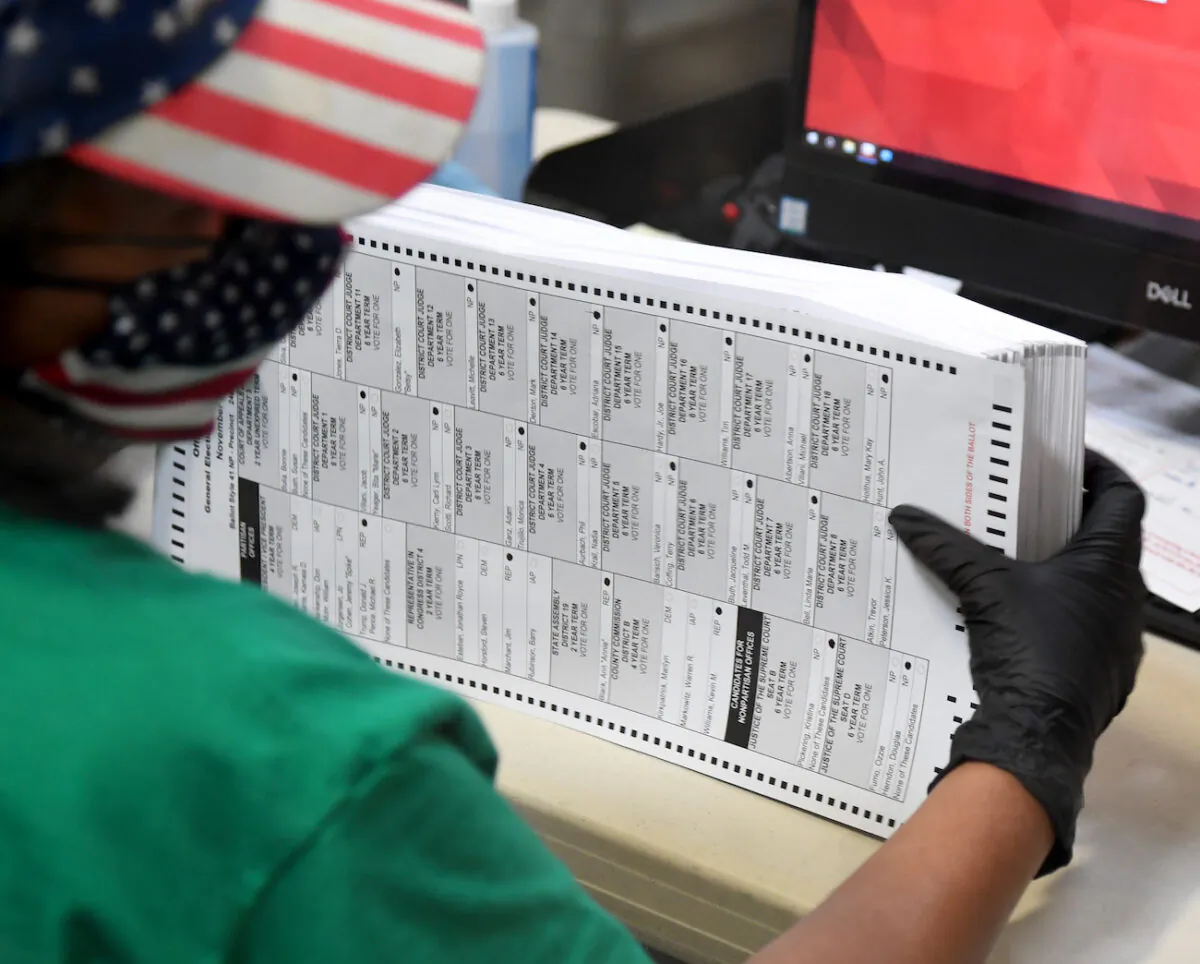 A Clark County election worker scans mail-in ballots at the Clark County Election Department in North Las Vegas, Nevada, on Nov. 7, 2020. (Ethan Miller/Getty Images)