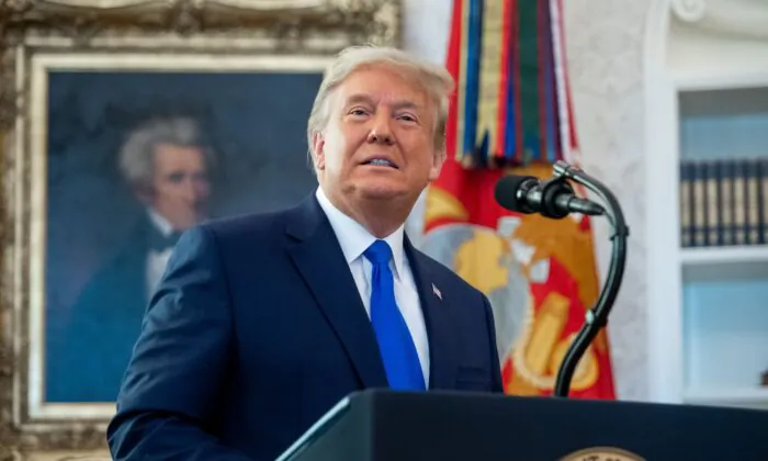 President Donald Trump speaks during a ceremony presenting the Presidential Medal of Freedom to wrestler Dan Gable in the Oval Office of the White House on Dec. 7, 2020. (Saul Loeb/AFP via Getty Images)