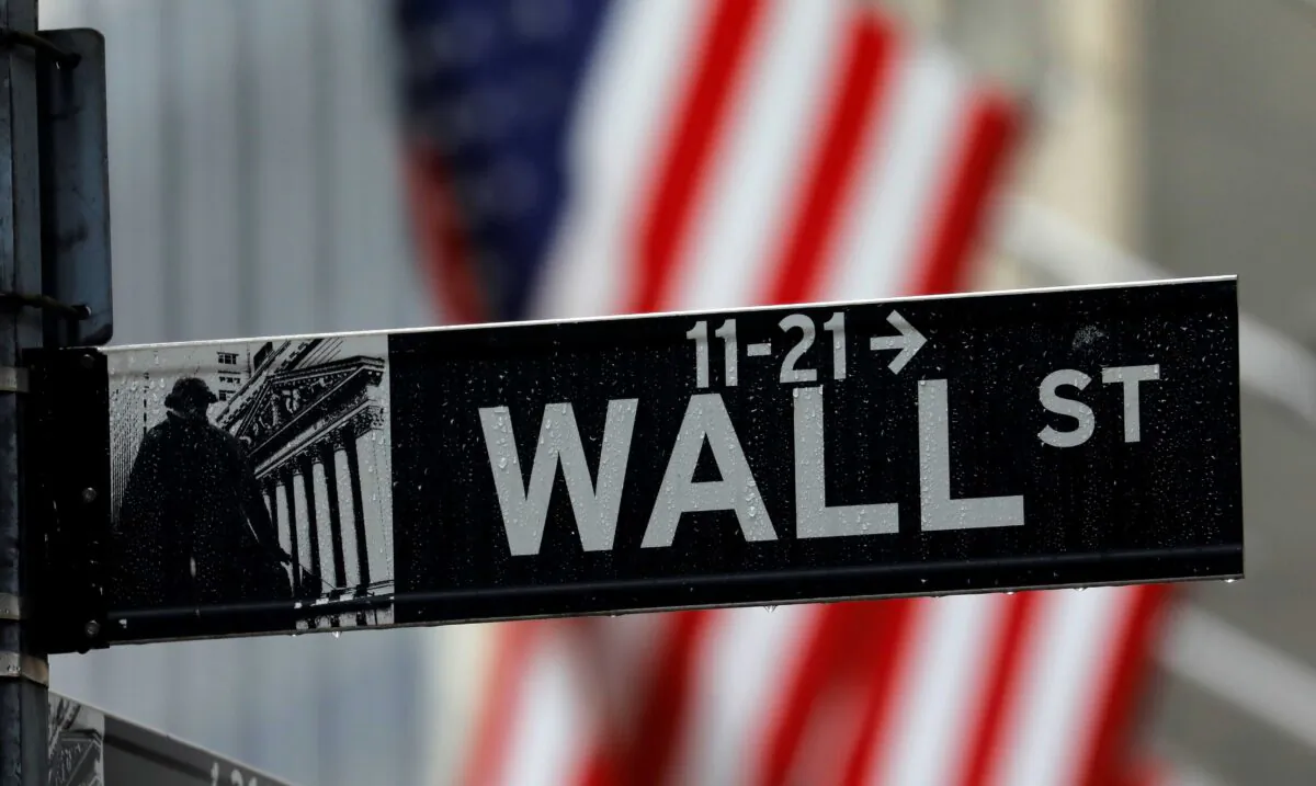 Raindrops hang on a sign for Wall Street outside the New York Stock Exchange in Manhattan in New York City, N.Y., on Oct. 26, 2020. (Mike Segar/Reuters)