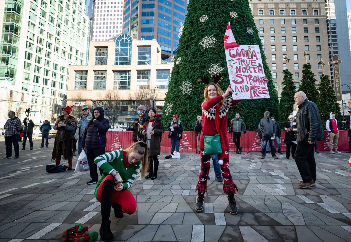 People gather for a rally protesting COVID-19 restrictions in Vancouver on Dec. 5, 2020. (The Canadian Press/Darryl Dyck)