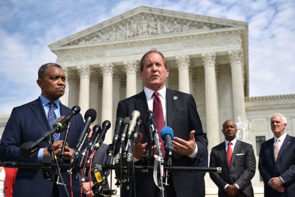 District of Columbia Attorney General Karl Racine (L) and Texas Attorney General Ken Paxton