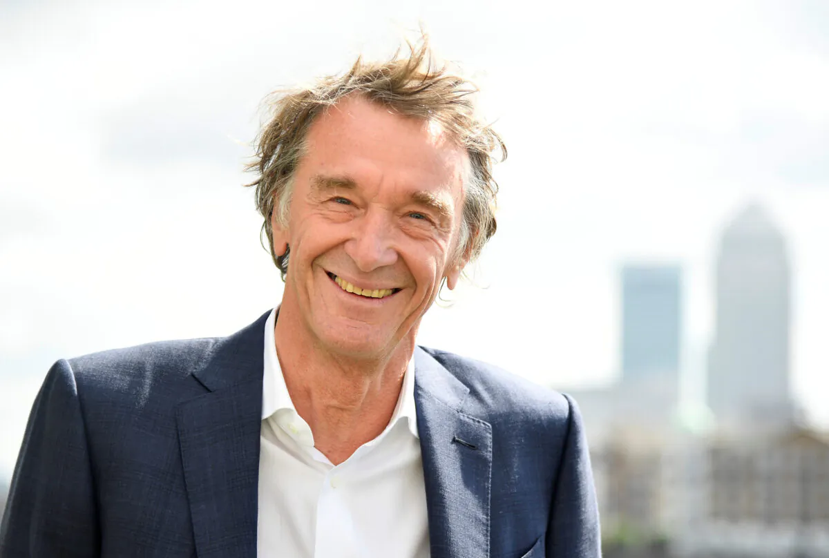 File photo shows Jim Ratcliffe, CEO of British petrochemicals company INEOS, posing for a portrait with the Canary Wharf financial district seen behind, in London, on April 26, 2018. (Toby Melville/Reuters)