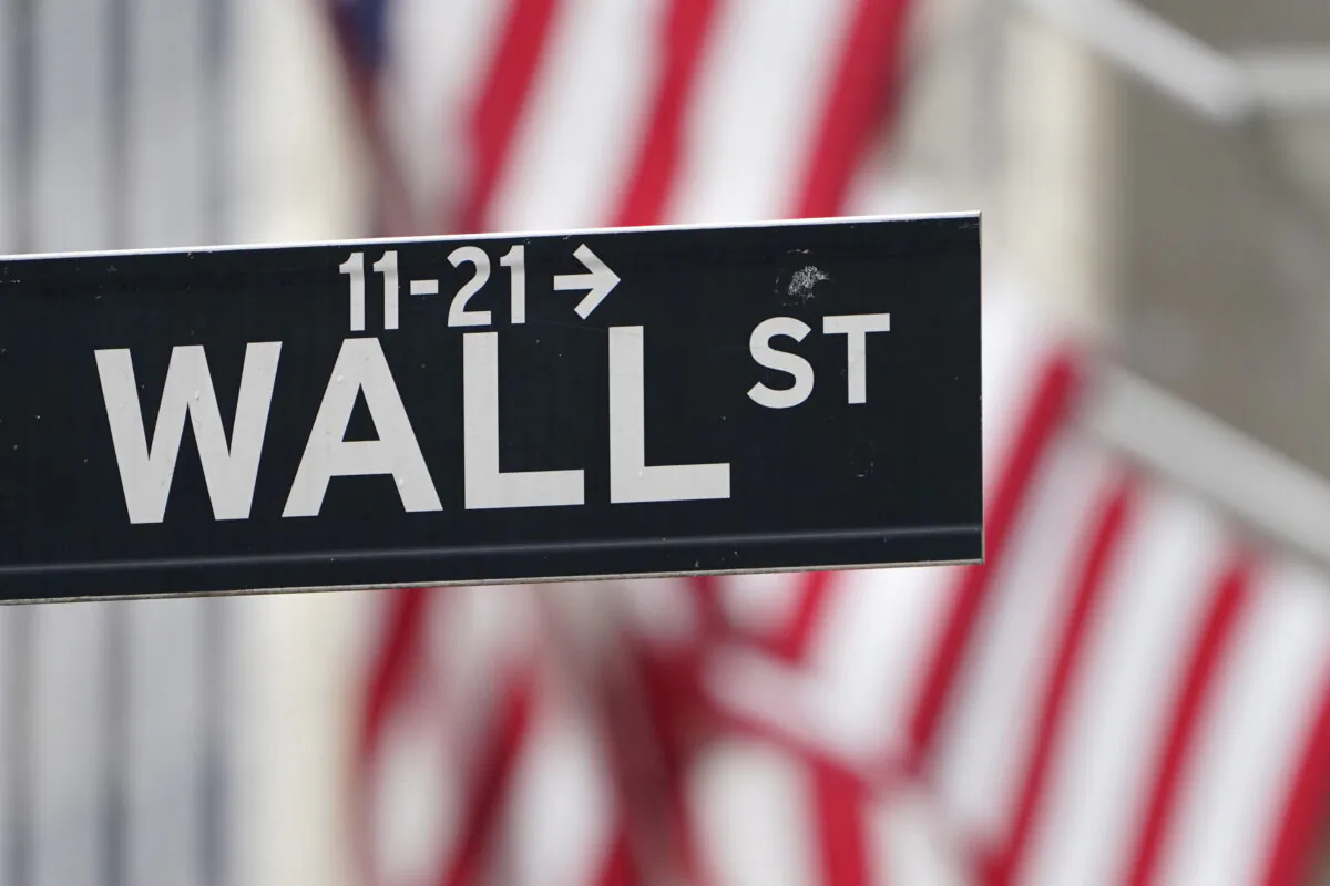 In this Nov. 23, 2020 file photo, a street sign is displayed at the New York Stock Exchange in New York. (Seth Wenig/ AP Photo, File)