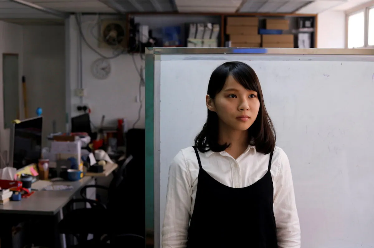 Student activist Agnes Chow poses for photo ahead of her campaign to join Legislative Council by election, at Demosisto party's office in Hong Kong, Dec. 8, 2017. (Tyrone Siu/Reuters)
