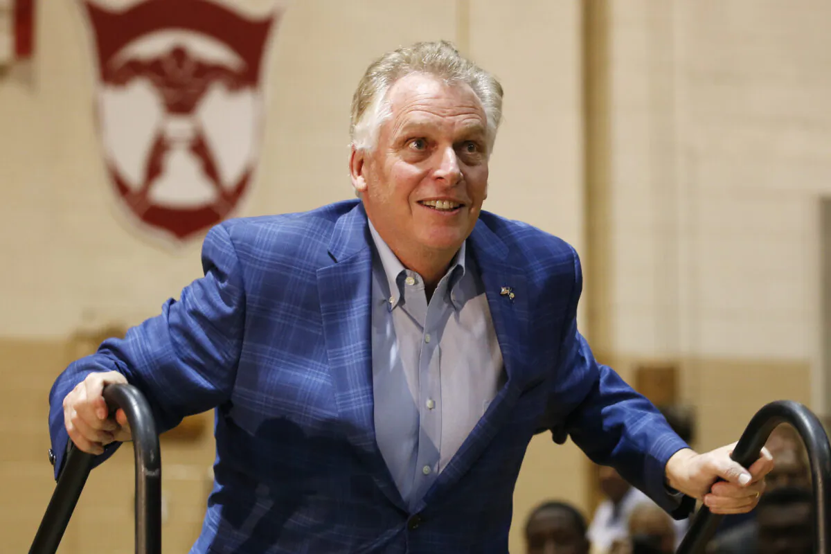 Former Virginia Gov. Terry McAuliffe walks up to the stage as he prepares to introduce Democratic presidential candidate and former Vice President Joe Biden during a campaign rally in Norfolk, Va., on March 1, 2020. (Steve Helber/AP Photo)