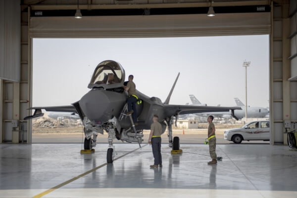 An F-35 fighter jet pilot and crew