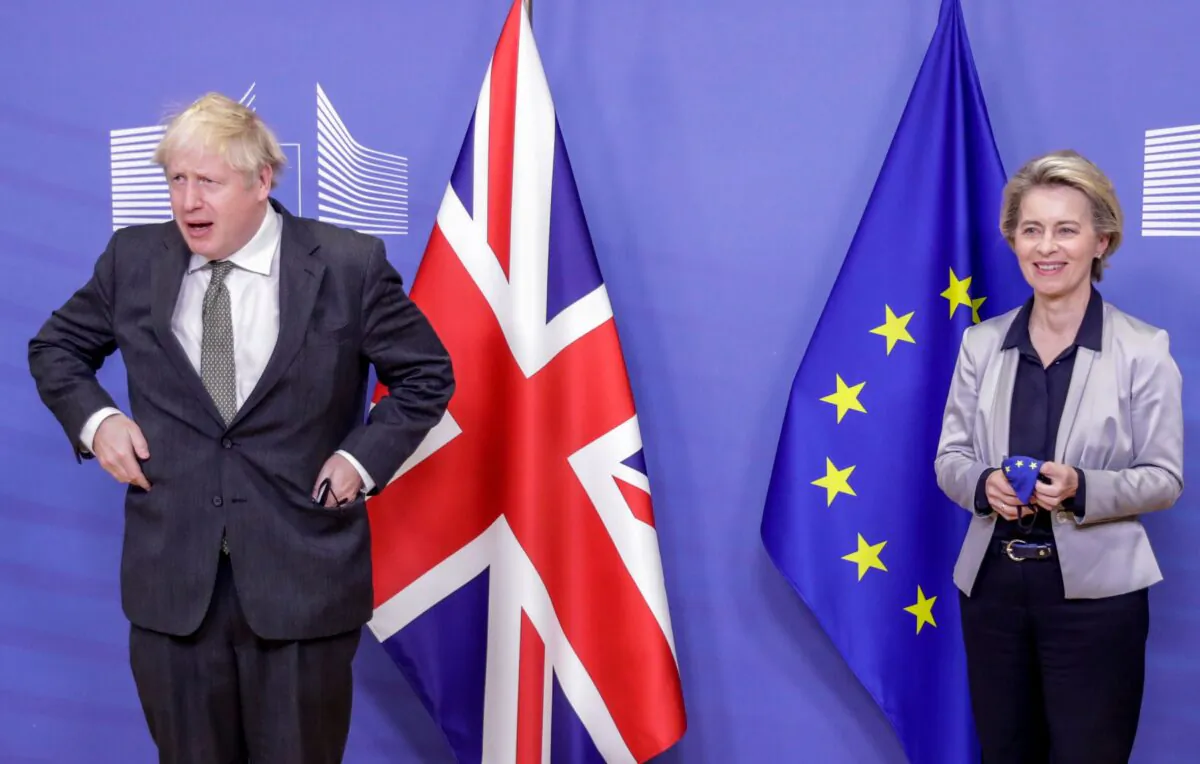 UK Prime Minister Boris Johnson is welcomed by European Commission President Ursula von der Leyen prior to a working dinner at the EU headquarters in Brussels, Belgium, on Dec. 9, 2020. (Olivier Hoslet/Pool/AFP via Getty Images)