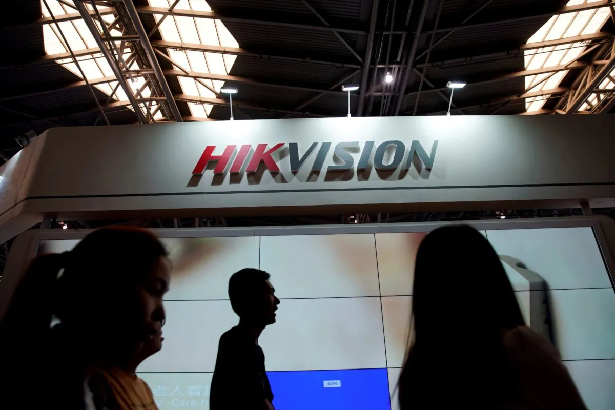 People visit a Hikvision booth at the security exhibition in Shanghai, China, on May 24, 2019. (Aly Song/Reuters)