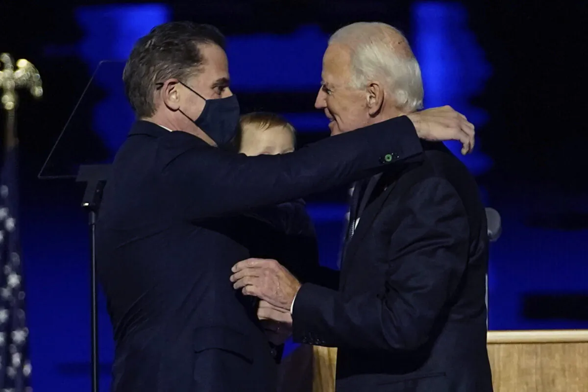 Hunter Biden (L) embraces his father, Democratic presidential nominee Joe Biden, in Wilmington, Del., on Nov. 7, 2020. (Andrew Harnik/Pool/AP Photo