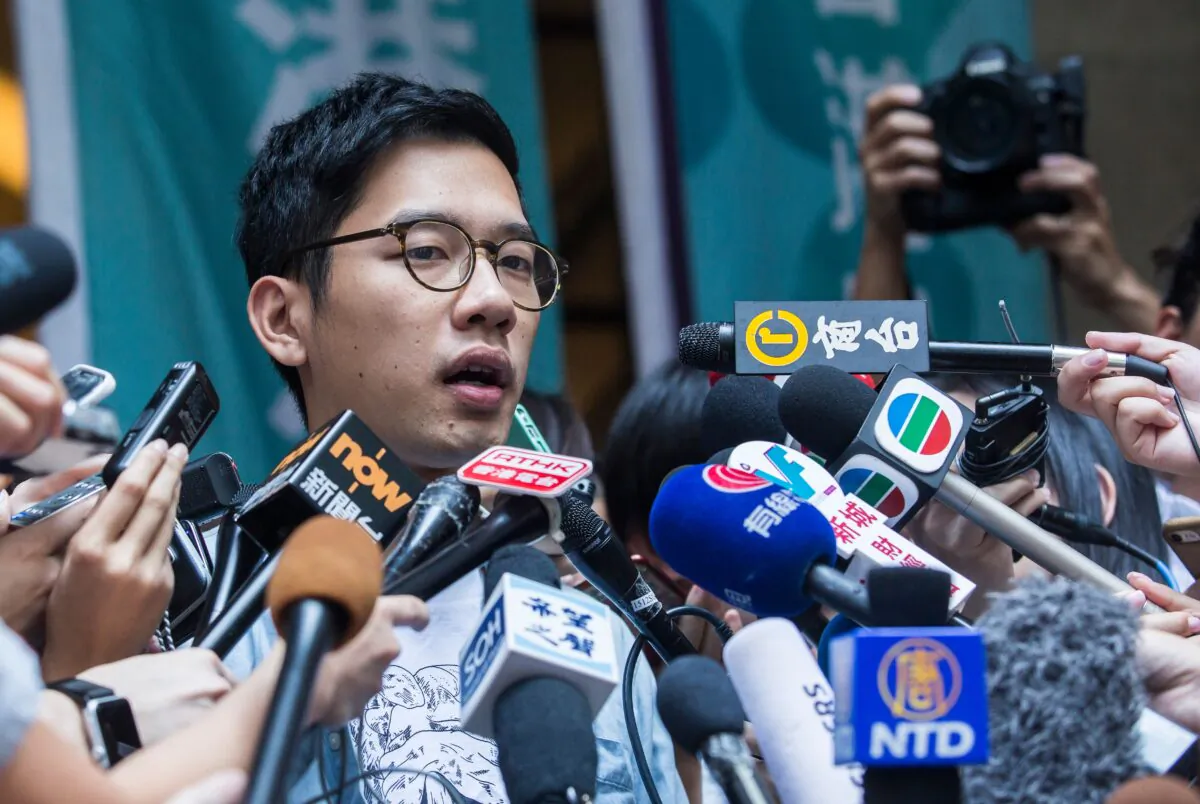 Pro-democracy activist Nathan Law speaks to the media outside the Court of Final Appeal after he and Joshua Wong's (not pictured) bail applications were successful at Hong Kong's highest court on Oct. 24, 2017. Jailed democracy activists Joshua Wong and Nathan Law were released on bail pending an appeal against convictions for their role in the 2014 Umbrella Movement protests. (Isaac Lawrence/AFP via Getty Images)