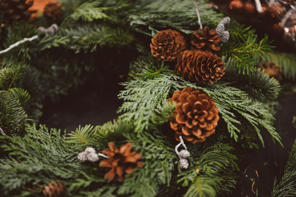 Use fresh greenery whenever possible to impart a Christmassy scent. (Olllllga/Shutterstock)