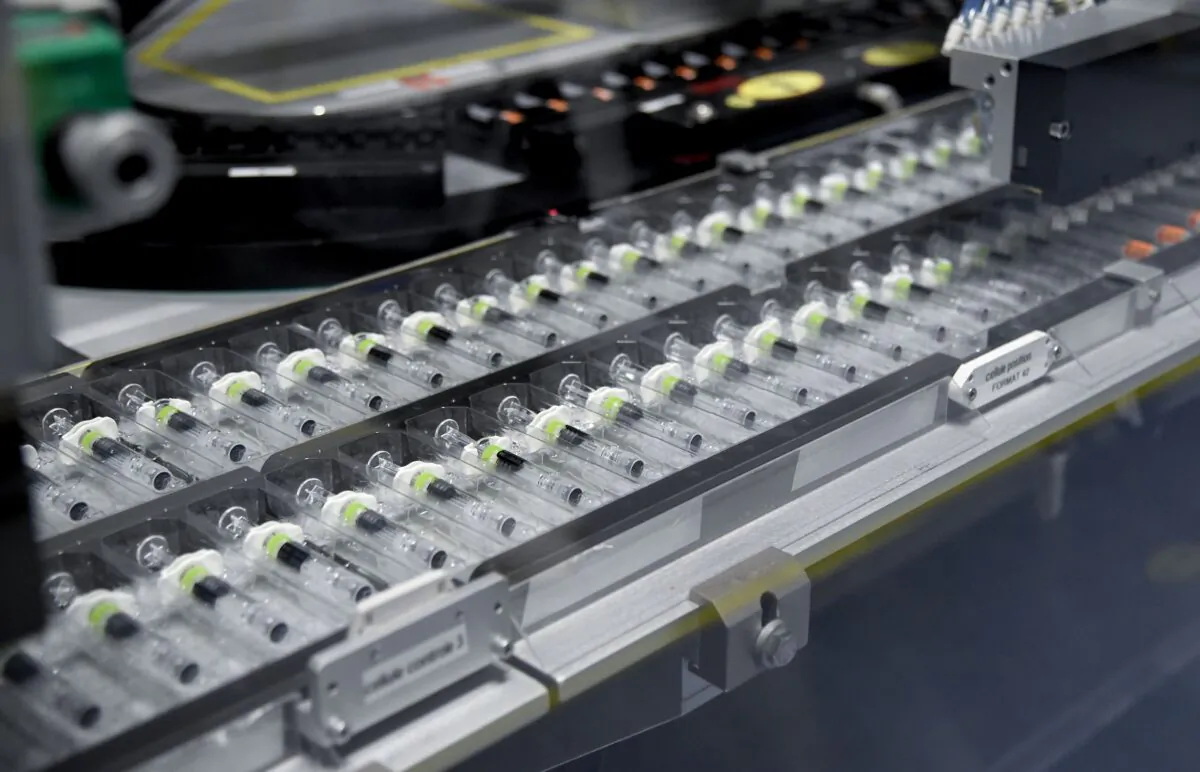 Vials are seen on a pdocution line at the factory of GlaxoSmithKline in Saint-Amand-les-Eaux, northern France, on Dec. 3, 2020. (Fancois Lo Presti/AFP via Getty Images)