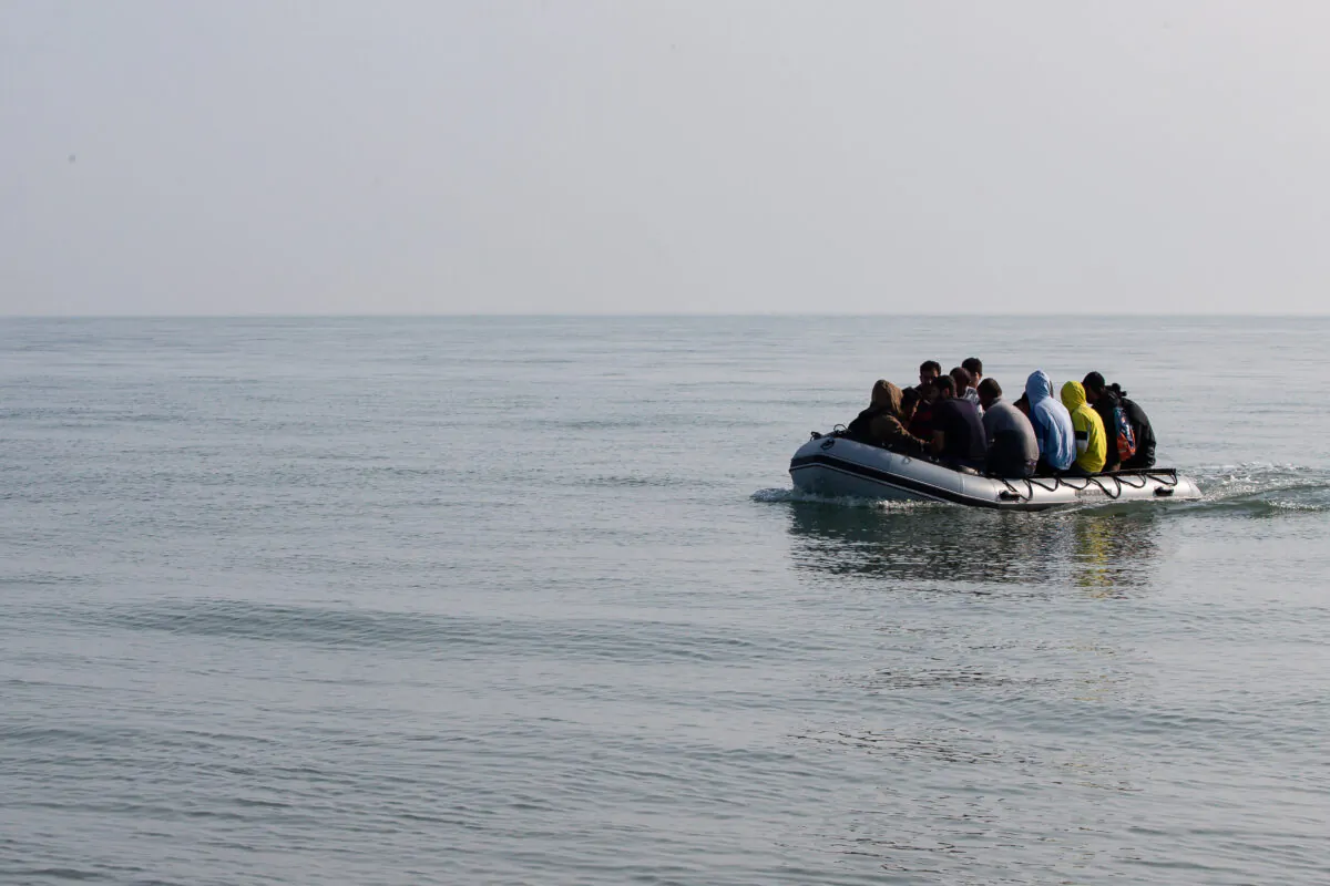 Migrants land on Deal beach after crossing the English channel from France in a dinghy, in Deal, England, on Sept. 14, 2020. (Luke Dray/Getty Images)