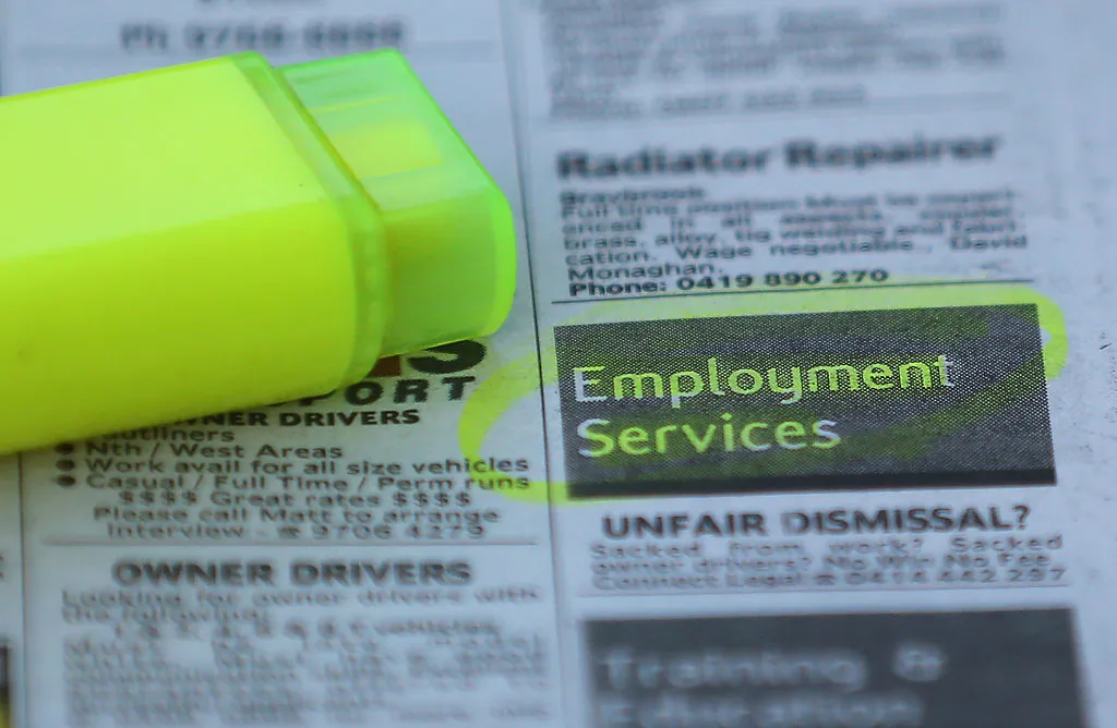 Employment advertisements are highlighted in a newspaper in Melbourne, Australia, on Oct. 9, 2014.  (Scott Barbour/Getty Images)