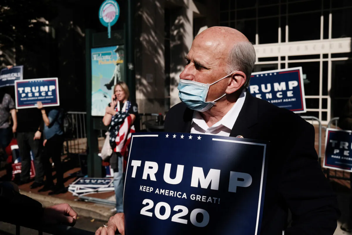 Rep. Louie Gohmert (R-Texas) holds a Trump 2020 sign outside of the Pennsylvania Convention Center in Philadelphia, on Nov. 06, 2020. (Spencer Platt/Getty Images)