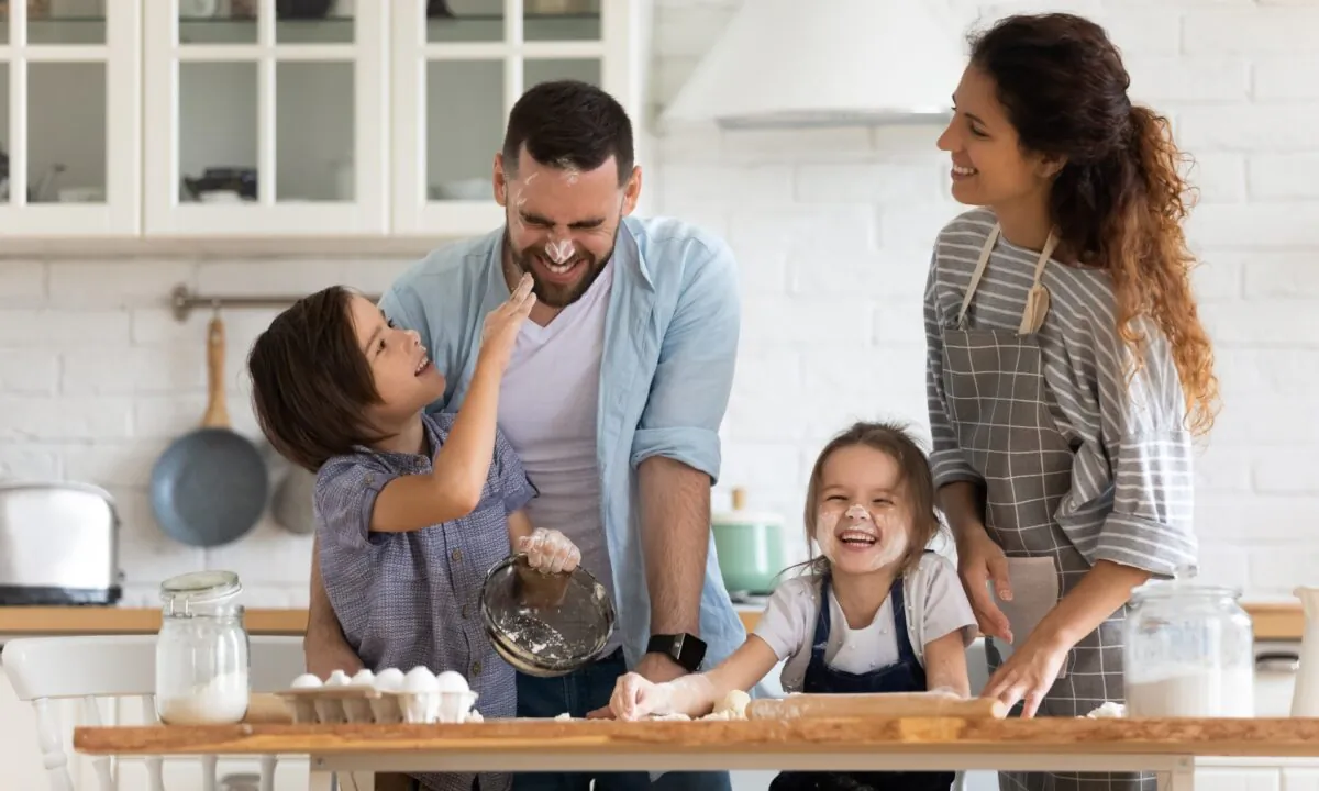 By cooking and baking together with your children, you’ll be creating memories that will last a lifetime. (fizkes/Shutterstock)