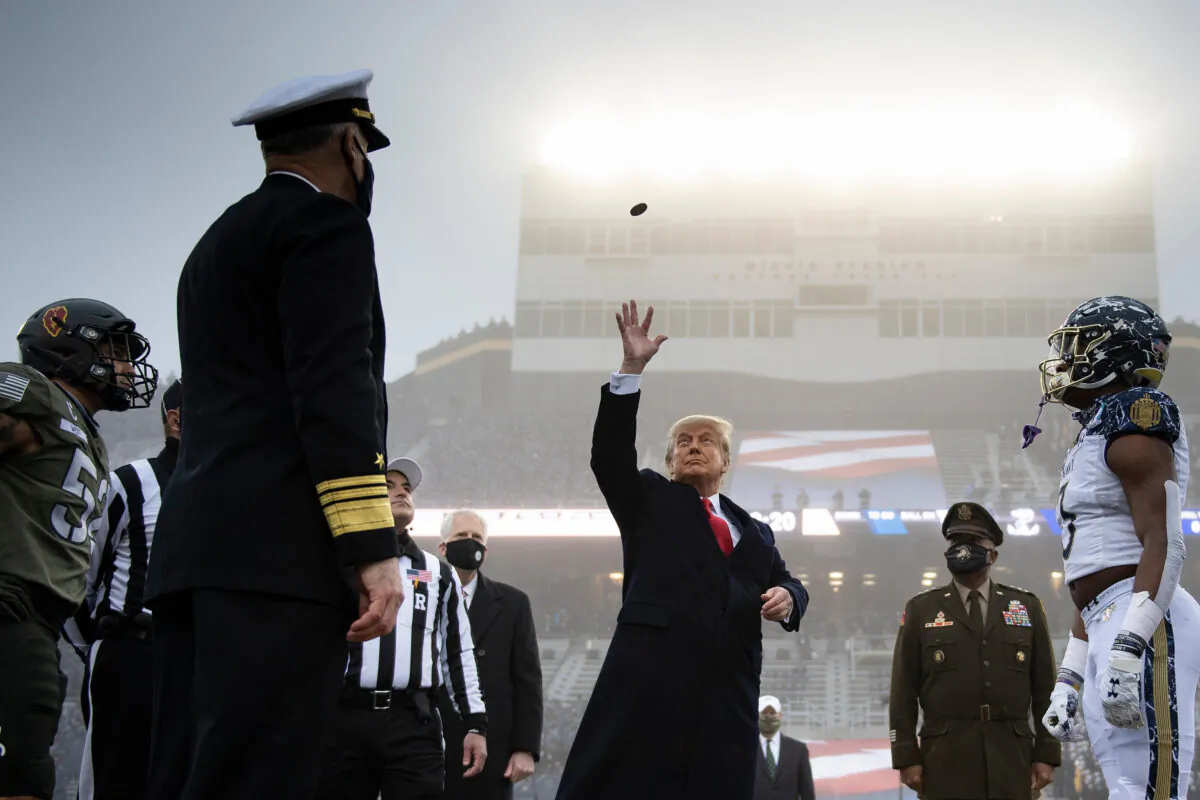 President Donald Trump tosses the coin before the Army-Navy football game at Michie Stadium in West Point, N.Y., on Dec. 12, 2020. (Brendan Smialowski/AFP via Getty Images)