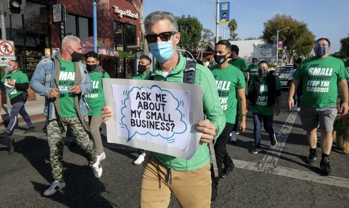 Members of small business owners take part in a “Save Small Business” protest in Los Angeles, on Dec. 12, 2020. (Ringo Chiu/AFP via Getty Images)