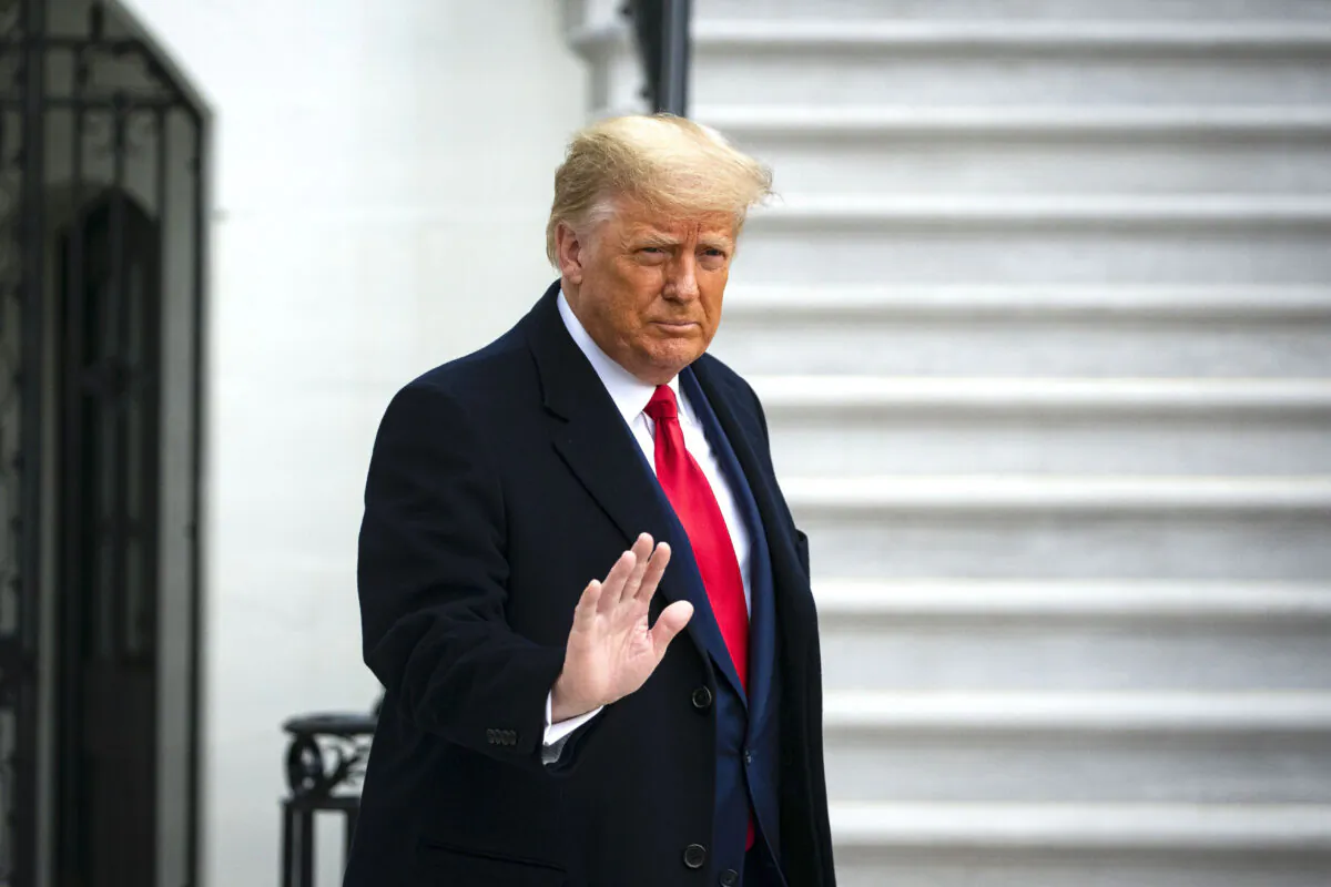 President Donald Trump waves as he departs on the South Lawn of the White House in Washington, on Dec. 12, 2020. (Al Drago/Getty Images)