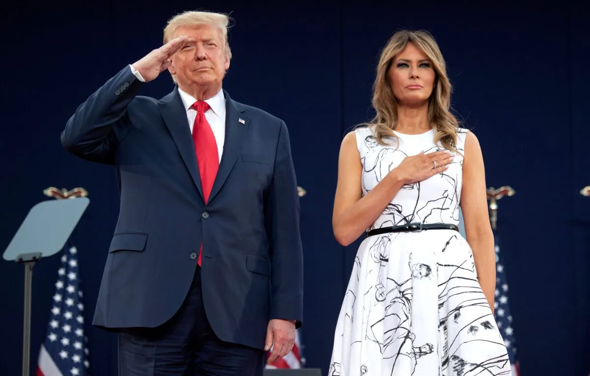 President Donald Trump and First Lady Melania Trump pay their respects as they listen to the national anthem during the Independence Day events at Mount Rushmore National Memorial in Keystone, S.D., on July 3, 2020. (Saul Loeb/AFP via Getty Images)