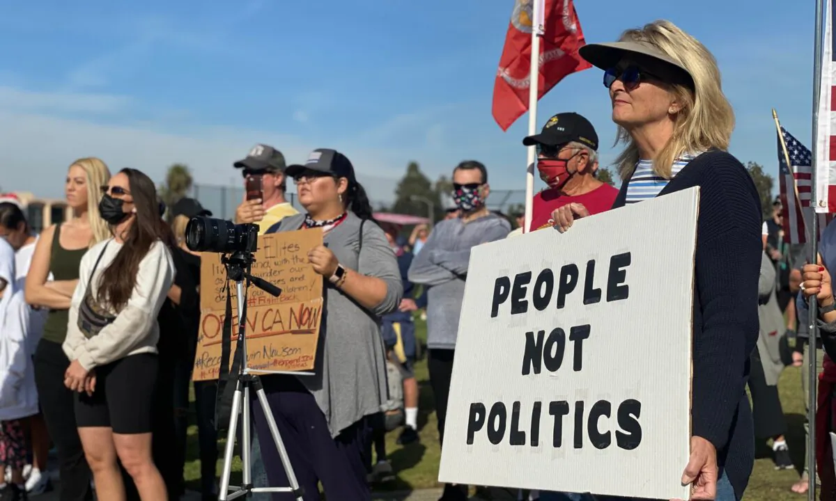 Protesters call for the opening of businesses in Newport Beach, Calif., on Dec. 13, 2020. (Jamie Joseph/The Epoch Times)
