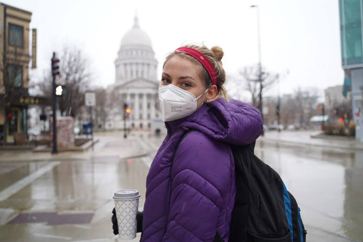 Samantha Armstrong stands in front of Wisconsin’s Capitol building in downtown Madison, on Dec. 11, 2020. (Cara Ding/The Epoch Times)