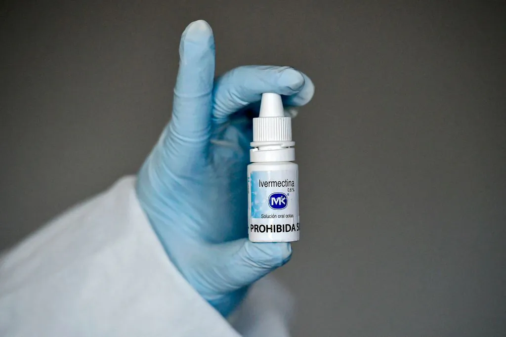A health worker shows a bottle of Ivermectin as part of a study of the Center for Paediatric Infectious Diseases Studies, in Cali, Colombia, on July 21, 2020. (Luis Robayo/AFP via Getty Images)
