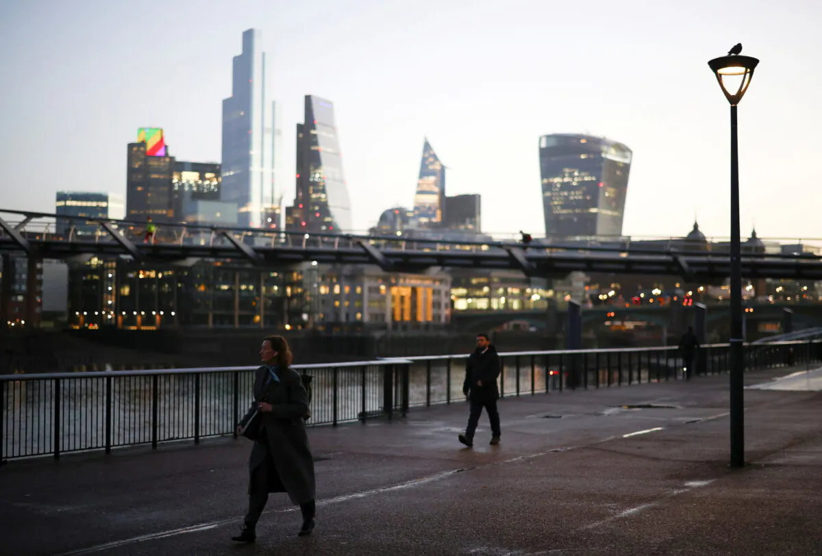 The financial district can be seen as a people walk along the South bank, amid the CCP virus outbreak, in London, on Dec. 14, 2020. (Reuters/Henry Nicholls)
