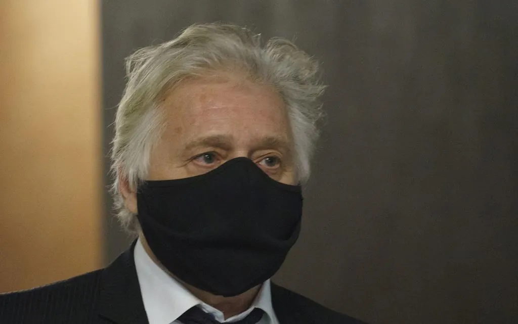 Just for Laughs founder Gilbert Rozon walks the hallways of the courthouse waiting for the verdict on his sexual assault trial in Montreal on Tuesday, December 15, 2020. (Paul Chiasson/The Canadian Press)