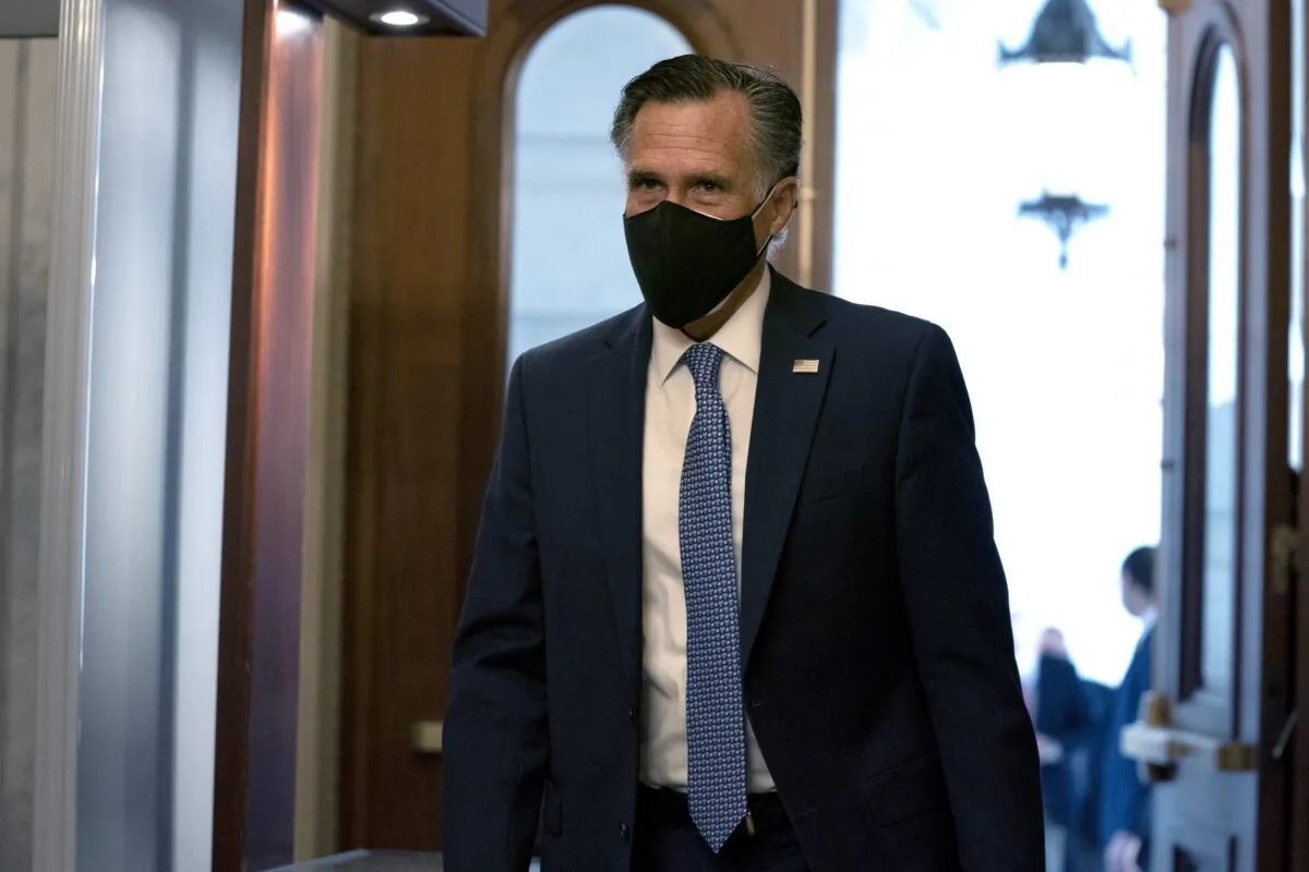 Sen. Mitt Romney (R-Utah) walks at the U.S. Capitol in Washington on Dec. 11, 2020. (Stefani Reynolds/Getty Images)