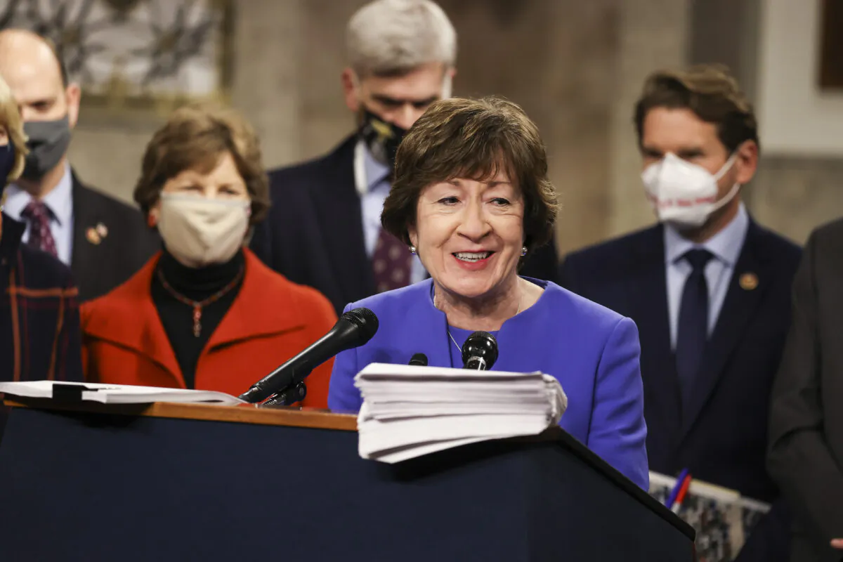 Sen. Susan Collins (R-Maine) speaks alongside a bipartisan group of Democrat and Republican members of Congress as they announce a proposal for a COVID-19 relief bill, on Capitol Hill in Washington on Dec. 14, 2020. (Tasos Katopodis/Getty Images)